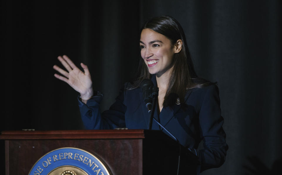 Rep. Alexandria Ocasio-Cortez, D-N.Y., delivers her inaugural address following her swearing-in ceremony at the Renaissance School for Musical Theater and Technology in the Bronx borough of New York on Saturday, Feb. 16, 2019. (AP Photo/Kevin Hagen)