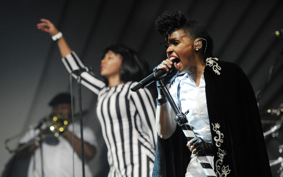 CORRECTS NAME OF EVENT FROM AUDI M3 TO AUDI A3 Janelle Monae, right, performs with her band during a launch party for the Audi A3 on Thursday, April 3, 2014 in West Hollywood, Calif. (Photo by Chris Pizzello/Invision/AP)