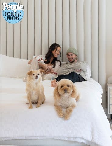 <p>Hannah Cree Photography</p> Michael Clifford and wife Crystal with daughter Lua and their two dogs