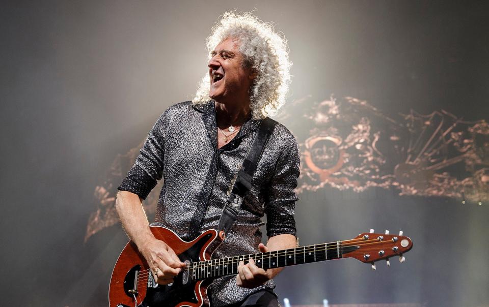 May and Queen will return to the stage for a rescheduled tour next year - Andrew Chin