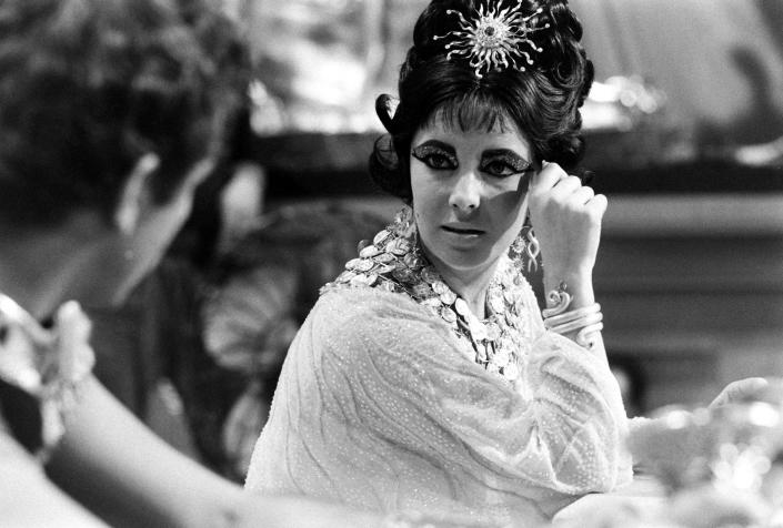 Elizabeth Taylor and Richard Burton in 1962 on the set of <i>Cleopatra</i>. At the time, Taylor was married to Eddie Fisher, but had begun a tempestuous (and highly public) affair with Burton.