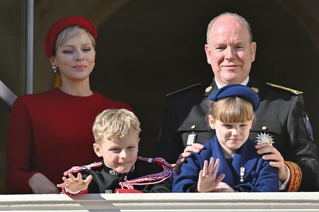 <p>Stephane Cardinale - Corbis/Corbis via Getty </p> Princess Charlene, Prince Jacques, Princess Gabriella and Prince Albert at the Monaco National Day celebrations on Nov. 19.