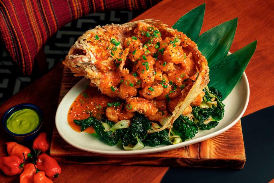 Pescado frito Nikkei, a whole snapper deboned and fried with spicy sauce, bok choy and white chaufa, is one of the specialties at Jarana in Aventura.