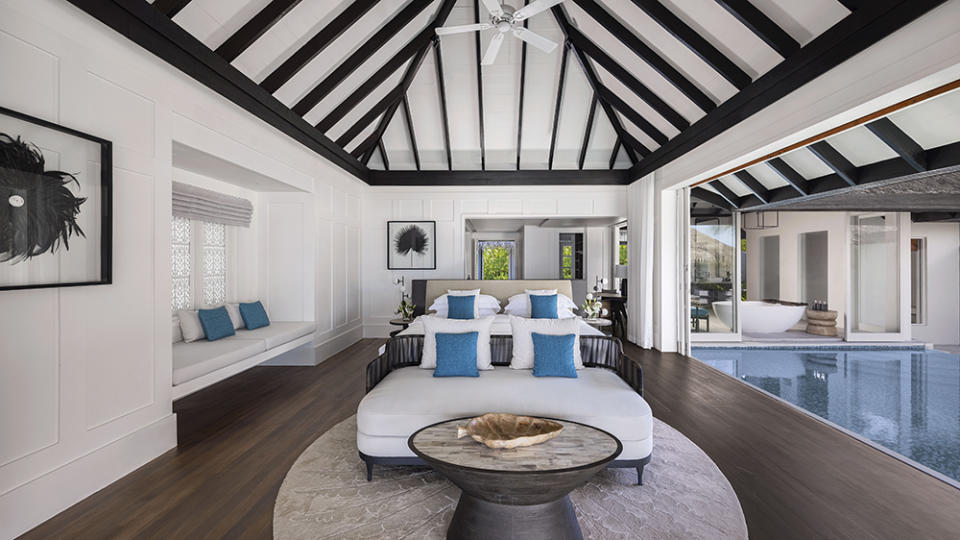 One of the expansive bedrooms with an open-air design and a pool. - Credit: Victor Romero