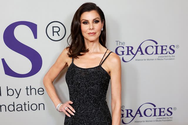 <p>MICHAEL TRAN/AFP via Getty Images</p> Heather Dubrow