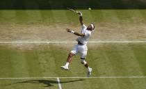 Argentina's Juan Martin Del Potro in action against Serbia's Novak Djokovic during day eleven of the Wimbledon Championships at The All England Lawn Tennis and Croquet Club, Wimbledon.