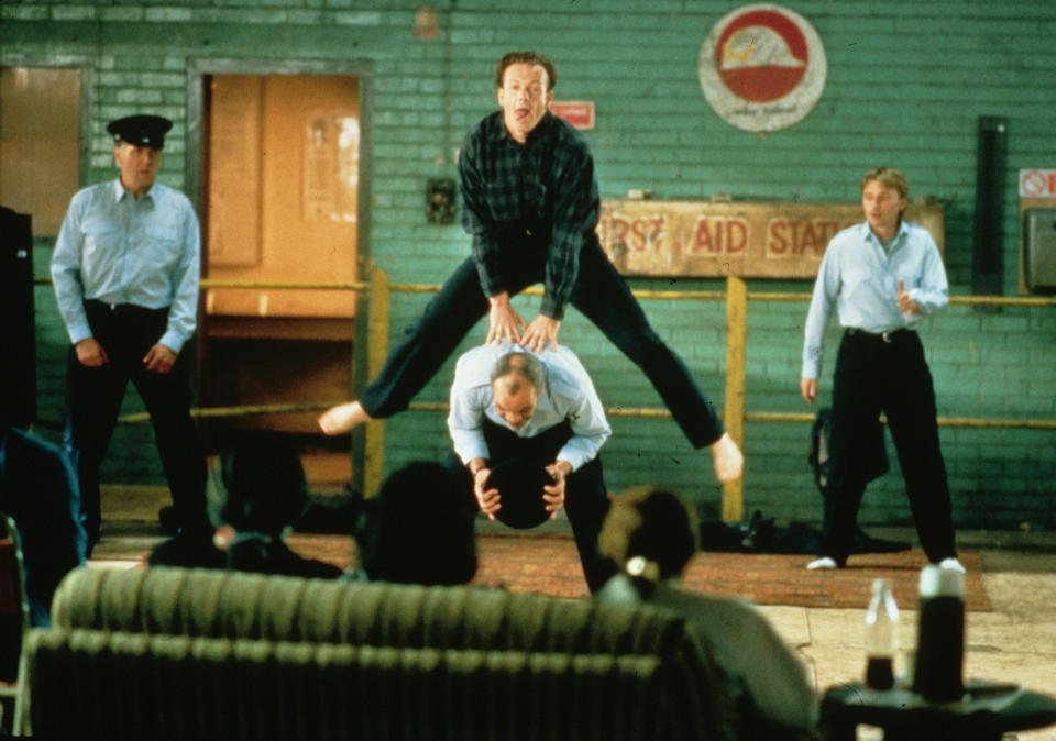 Hugo Speer leapfrogging in The Full Monty (20th Century Fox)