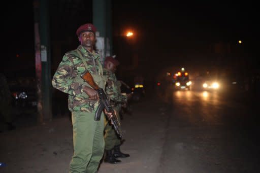 Kenyan policemen secure the blast area after explosions on March 10, 2012 at a bus station in downtown Nairobi. The attack killed at least six people and wounded 63, according to a new toll issued by Kenyan Interior Minister George Saitoti