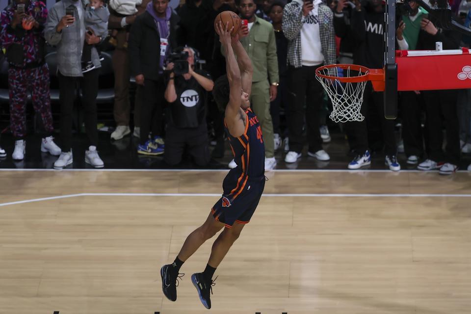 Jericho Sims of the New York Knicks shoots during the slam dunk competition of the NBA basketball All-Star weekend Saturday, Feb. 18, 2023, in Salt Lake City. (AP Photo/Rob Gray)