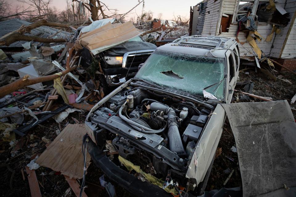 Car sit destroyed among debris after a tornado in Dawson Springs, Kentucky.