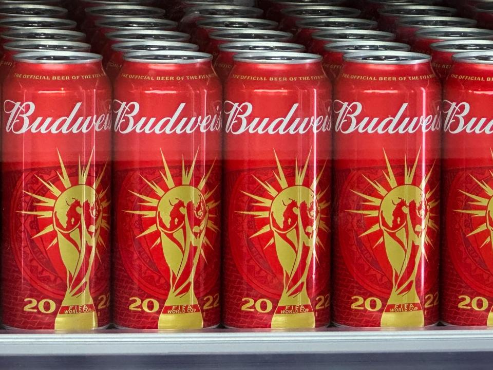 Cans of Budweiser beer featuring the FIFA World Cup logo are displayed in Doha on November 18, 2022 ahead of the Qatar 2022 World Cup football tournament.