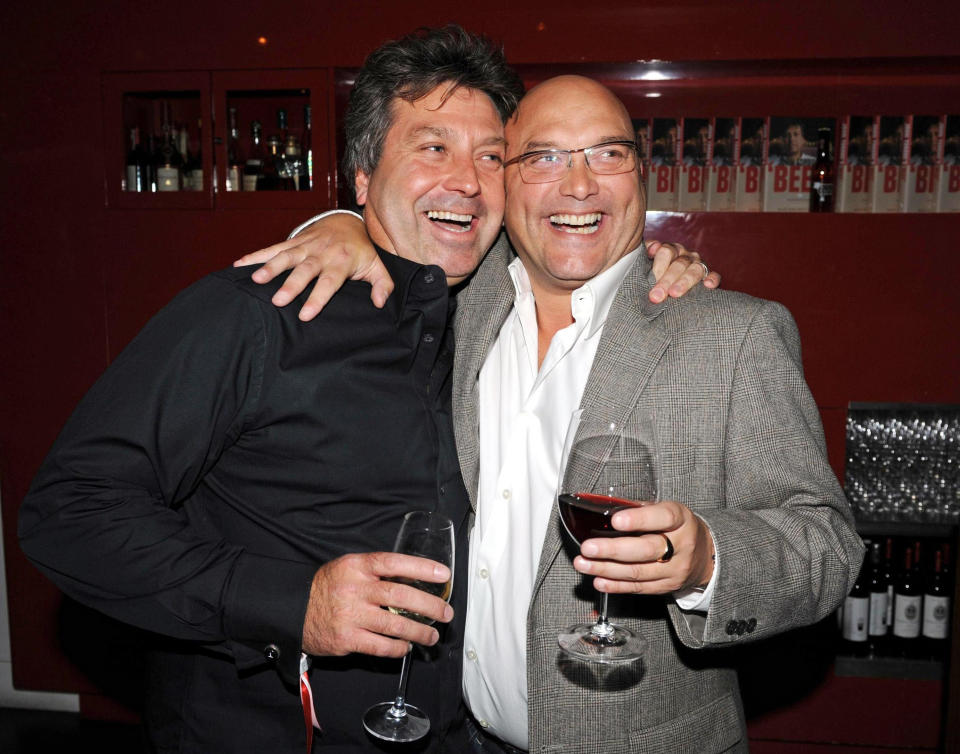 Chef John Torode (r) poses with fellow Masterchef presenter Gregg Wallace as he launches his new book 'Beef' at Smith's of Smithfield, Charterhouse Street, in central London.   (Photo by Anthony Devlin - PA Images/PA Images via Getty Images)