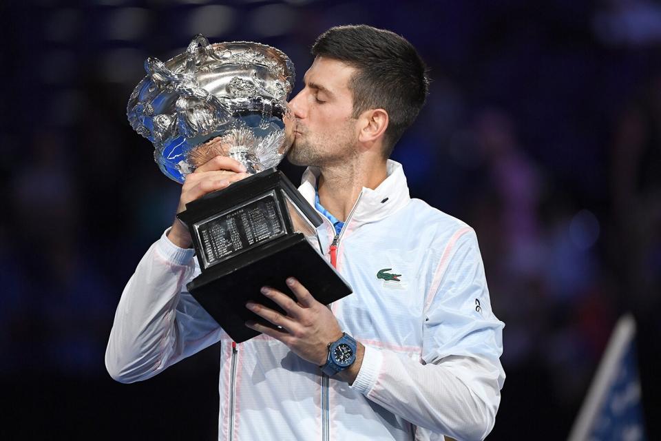 Novak Djokovic of Serbia poses with the Norman Brookes Challenge Cup after winning the Men's Singles Final match against Stefanos Tsitsipas of Greece