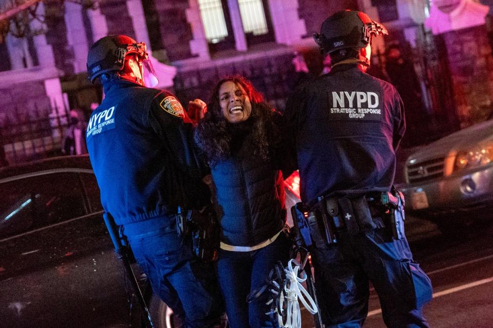 Police arrest a protester during demonstrations at The City College Of New York (Getty)