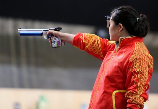 Gold medalist Chinese Guo Wenjun competes in the women's 10m air pistol event at the Royal artillery Barracks in London, during the London 2012 Olympic Games