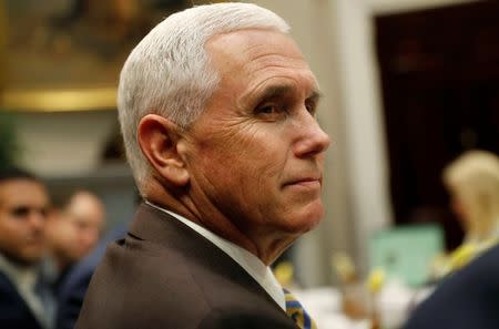 ‪FILE PHOTO: Vice President Mike Pence‬ listens during a working lunch with governors and U.S. President Donald Trump in the Roosevelt Room at the White House in Washington, U.S., June 21, 2018. REUTERS/Leah Millis