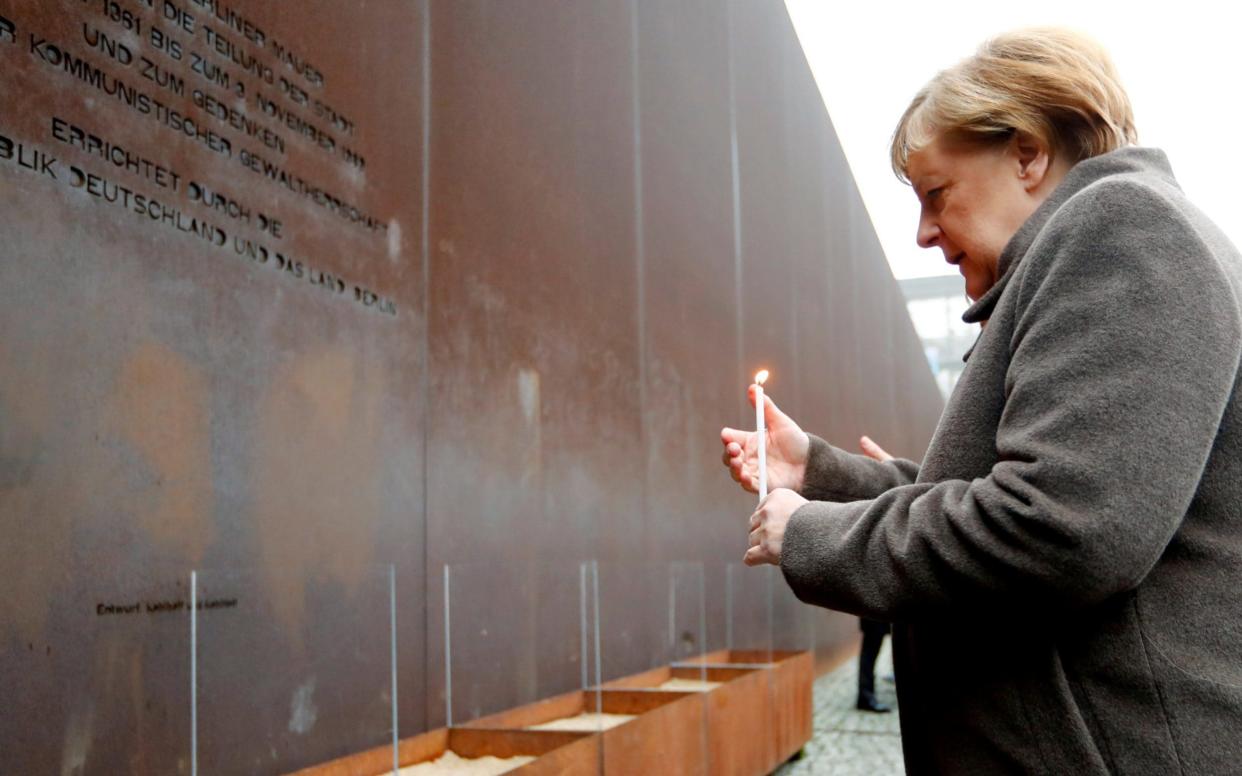 Angela Merkel appealed for European leaders to defend democracy and freedom as Germany marked 30 years since the fall of the Berlin Wall - REUTERS