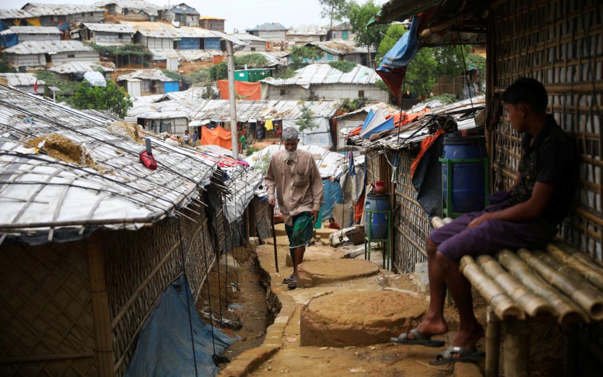 A Rohingya refugee walks at a refugee camp in Cox's Bazar, Bangladesh - Reuters