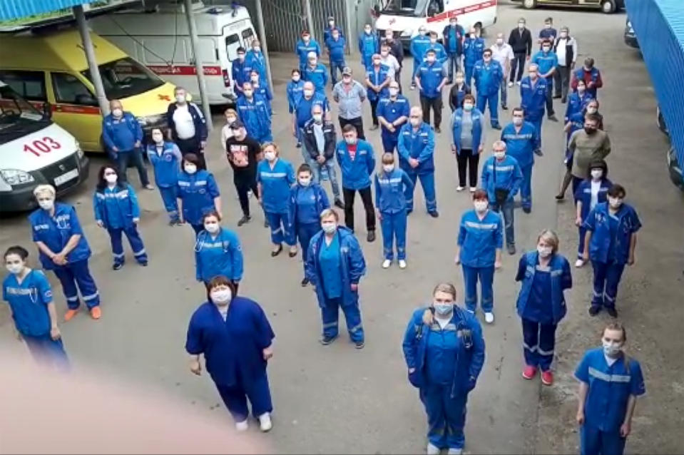 In this handout photo taken from video footage, medical workers record s video appeal to Russian President Vladimir Putin in Armavir, Russia, Saturday, May 16, 2020. Dozens of medical workers all across the country, from Siberia to southern Russia, made similar videos over the weekend, demanding the bonuses President Vladimir Putin promised them for working with coronavirus patients. Many said they had received 10 to 100 times less than was promised. (Grigory Kramchanin via AP)