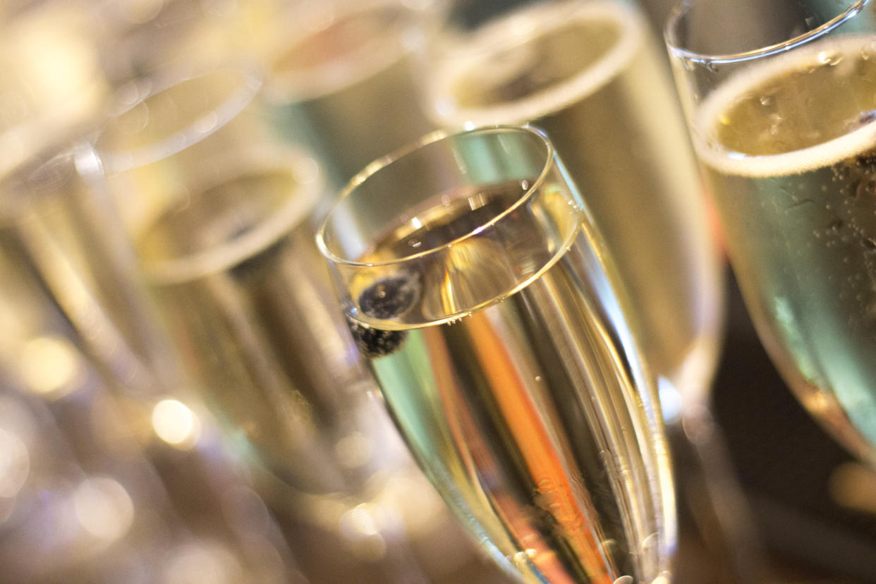 Champagne sparkling white wine glasses in restaurant bar in wedding reception party photo.