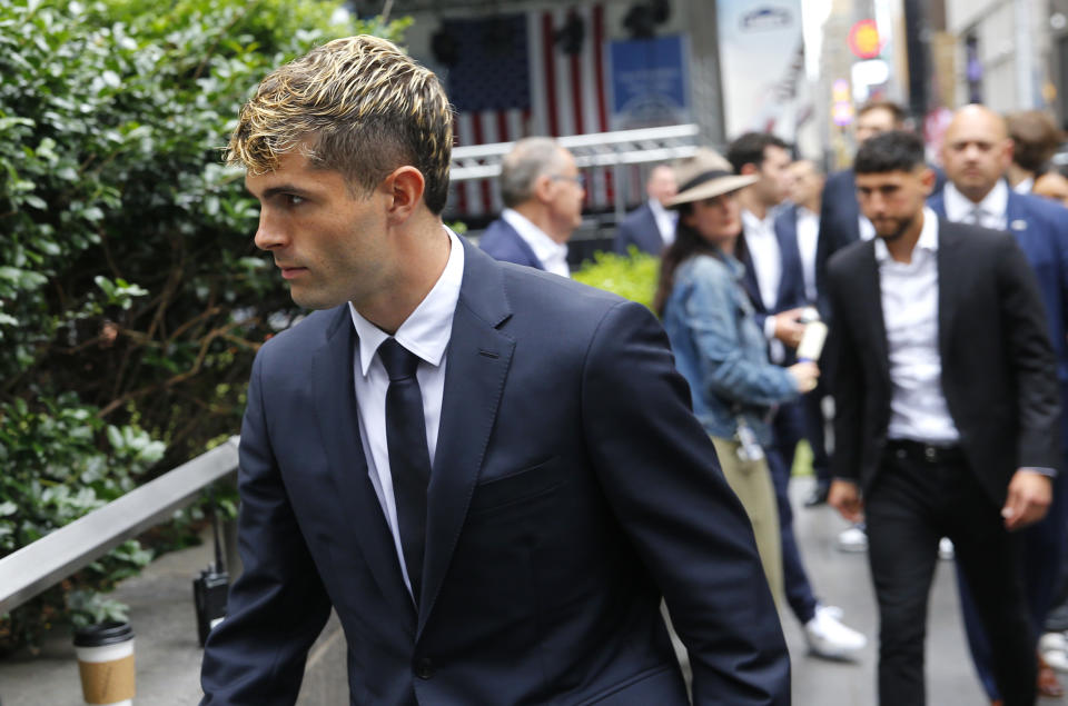 United States soccer star Christian Pulisic arrives for FIFA's announcement of the names of the host cities for the 2026 World Cup soccer tournament, Thursday, June 16, 2022, in New York. (AP Photo/Noah K. Murray)