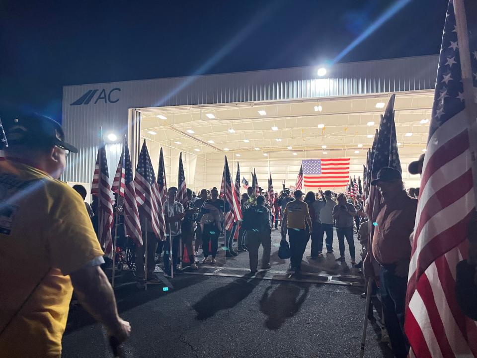 Family, friends and community members line the runway to greet veterans as they return from their Honor Flight trip, April 27, 2024.