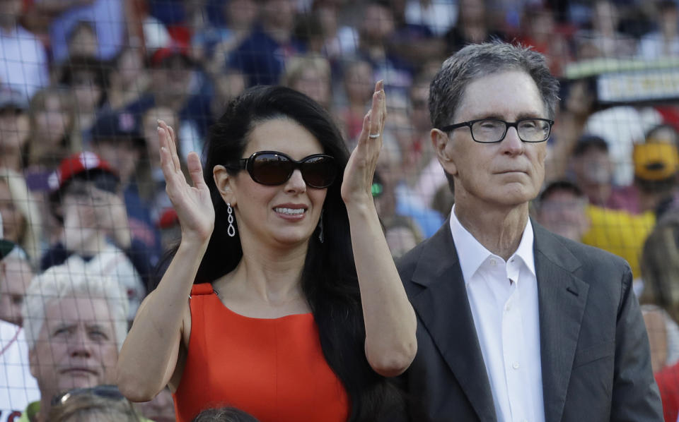 Boston Red Sox owner John Henry, right, with his wife Linda Pizzuti Henry at a baseball game in Boston