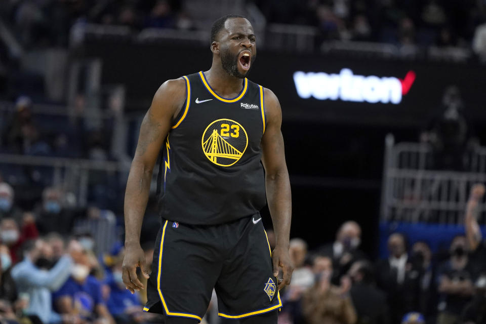 Golden State Warriors forward Draymond Green (23) reacts toward the Miami Heat bench after shooting a 3-point basket during the second half of an NBA basketball game in San Francisco, Monday, Jan. 3, 2022. (AP Photo/Jeff Chiu)