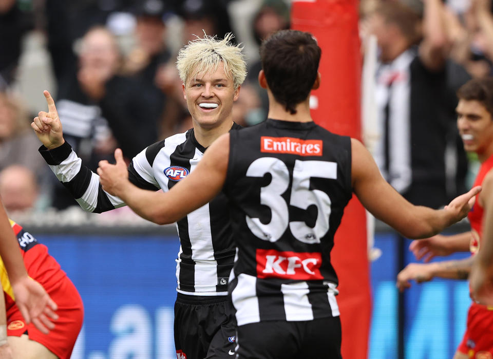 Jack Ginnivan (pictured) celebrates after scoring a goal during the round seven AFL match between the Collingwood Magpies and the Gold Coast Suns. 