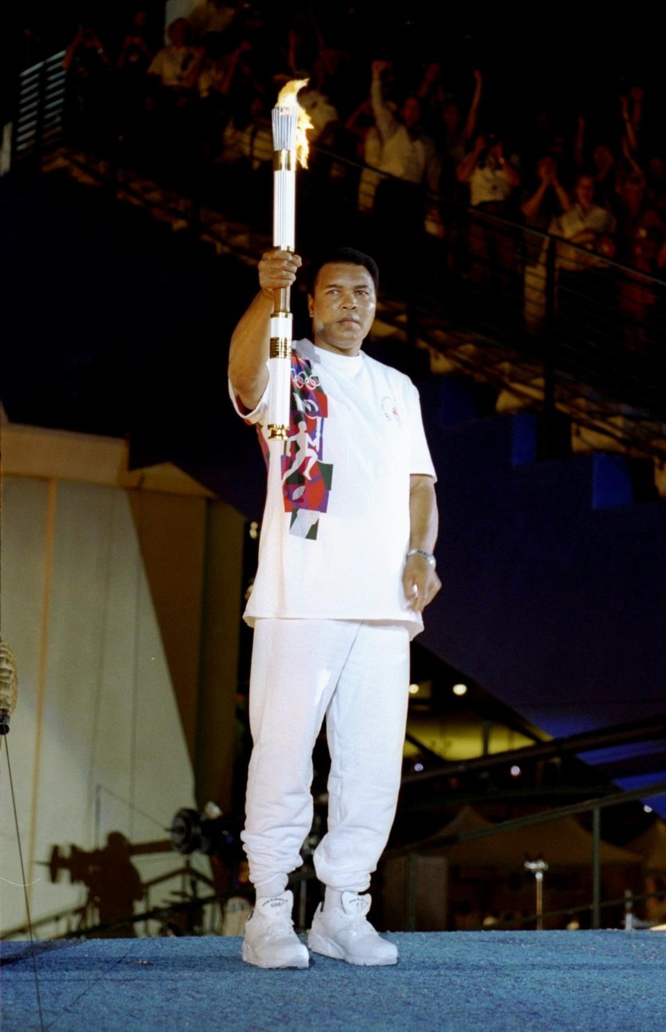 Muhammad Ali holding the Olympic torch at the 1996 Olympics in Atlanta. (Photo: Getty Images).