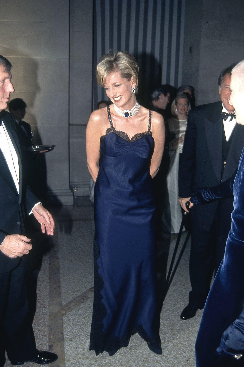 <p>Way before they were ubiquitous, Diana rocked up to the 1995 Met Gala in a lace-trimmed, navy slip dress, wowing guests and fashion critics alike. <em>[Photo: Getty]</em> </p>