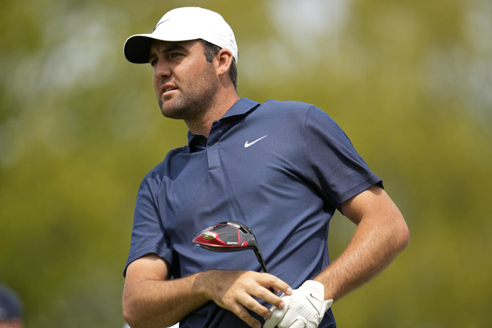 Scottie Scheffler watches his tee shot on the 16th hole during a practice around for the PGA Championship golf tournament at Oak Hill Country Club on Tuesday, May 16, 2023, in Rochester, N.Y. (AP Photo/Abbie Parr)