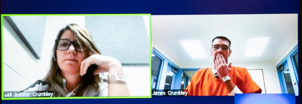 Jennifer Crumbley looks on from left as her husband James Crumbley appears to sign something to her, as the prosecuting attorneys and their defense attorneys went to a private video chat with Judge Nicholson as they challenged their bond. Jennifer Crumbley and James Crumbley are the parents of Ethan Crumbley, the teen accused of the fatal Oxford School Shooting. The couple is asking for a lower bond on Jan. 7, 2022, in the 52-3 courtroom but Judge Nicholson in Rochester Hills denied their request.