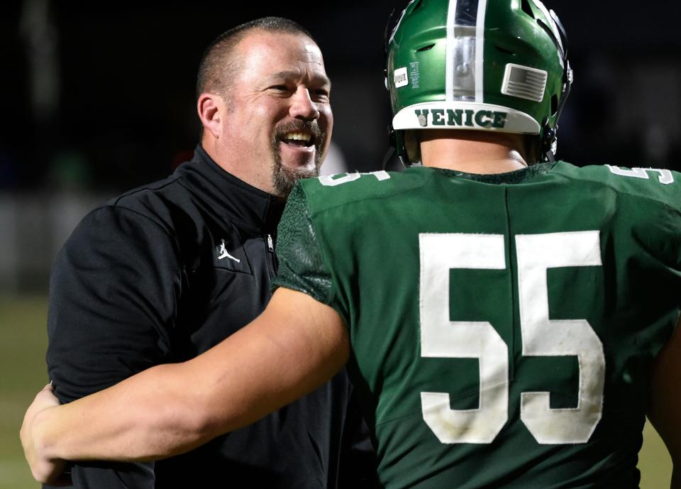 Venice head coach John Peacock and defensive lineman Trenton Kintigh celebrate Venice's victory over the Buchholz Bobcats in a 2022 Class 4 Suburban state semifinal at Powell-Davis Stadium in Venice. But Peacock and his team have lost the last two years in the state finals.