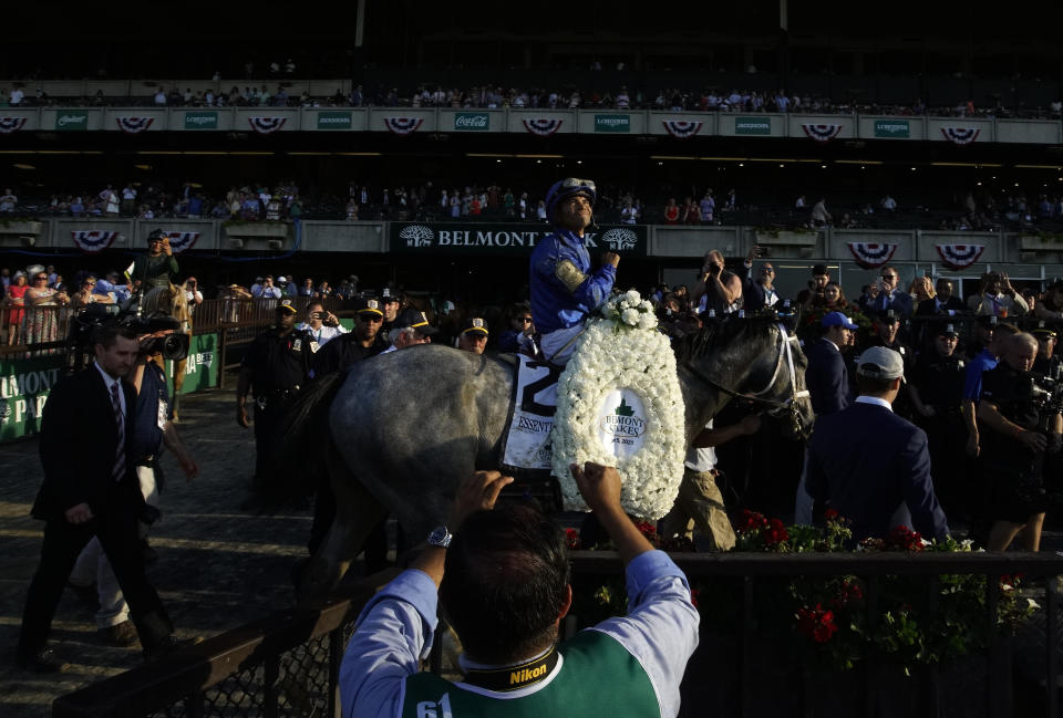 Essential Quality (2), with jockey Luis Saez up, walks to the winner's circle after winning the 153rd running of the Belmont Stakes horse race, Saturday, June 5, 2021, at Belmont Park in Elmont, N.Y. (AP Photo/Eduardo Munoz Alvarez)