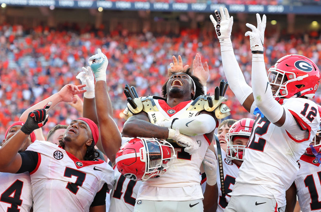 Georgia teammates celebrate during last week’s win over Auburn. (Kevin C. Cox/Getty Images)