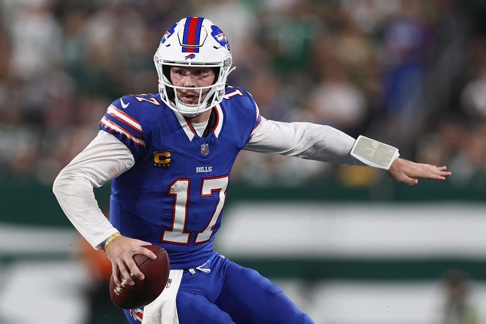 Quarterback Josh Allen #17 of the Buffalo Bills scrambles with the football during the second quarter of the NFL game against the New York Jets at MetLife Stadium on September 11, 2023 in East Rutherford, New Jersey.