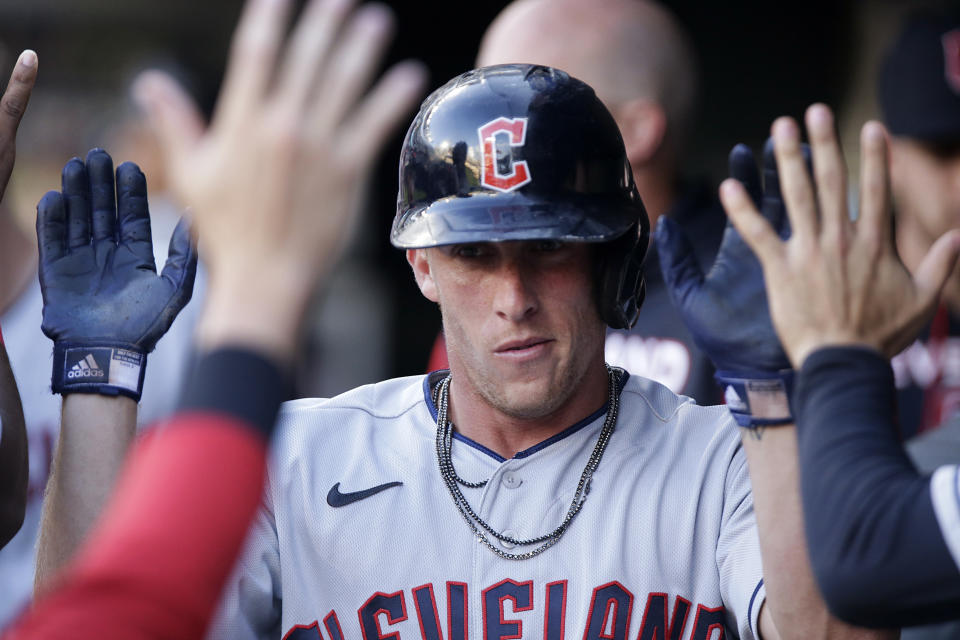 Cleveland Guardians' Myles Straw is congratulated after scoring against the Minnesota Twins during the third inning of a baseball game Wednesday, June 22, 2022, in Minneapolis. (AP Photo/Andy Clayton-King)