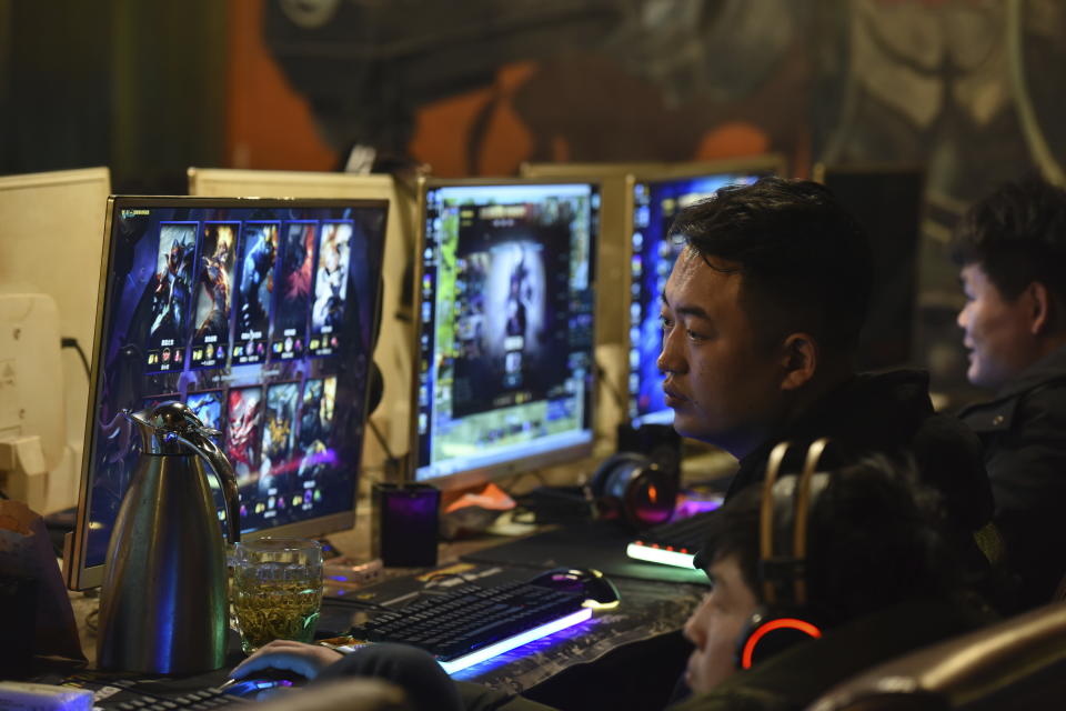 CORRECTS NUMBER OF GAMES TO 105 - People play online games in an internet cafe in Fuyang in central China's Anhui province Friday, March 1, 2019. China's authority in charge of press and publications has approved 105 online games, saying it fully supports the industry after newly proposed curbs caused massive losses for major game companies. The National Press and Publication Administration issued a statement on its Weibo social media account Monday, Dec. 25, 2023, saying the approvals demonstrate active support for the development of online games. (Chinatopix via AP)