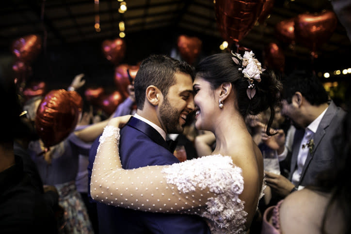 wedding couple smiling and dancing