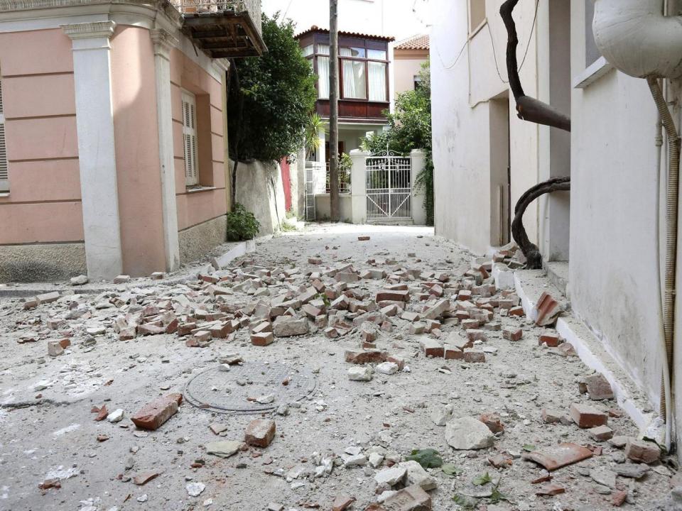 Authorities in Lesbos said dozens of homes were damaged in parts of the island and some roads were closed (EPA/MANOLIS LAGOUTARIS)