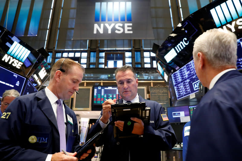 Traders work on the floor of the New York Stock Exchange (NYSE) in New York, U.S., August 16, 2017. REUTERS/Brendan McDermid