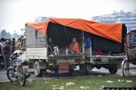 People rest in temporary shelter in open areas in Kathmandu