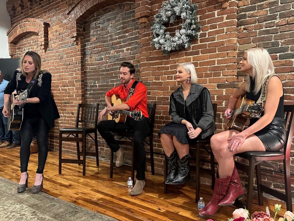 Caitlyn Smith performs along with fellow Monument artists Alex Hall and sisters Kendra and Krista Slaubaugh, of the duo Tigirlily Gold. Each artist is releasing Christmas music and debuted the songs at an early holiday party held at the Monument office on October 23, 2023.