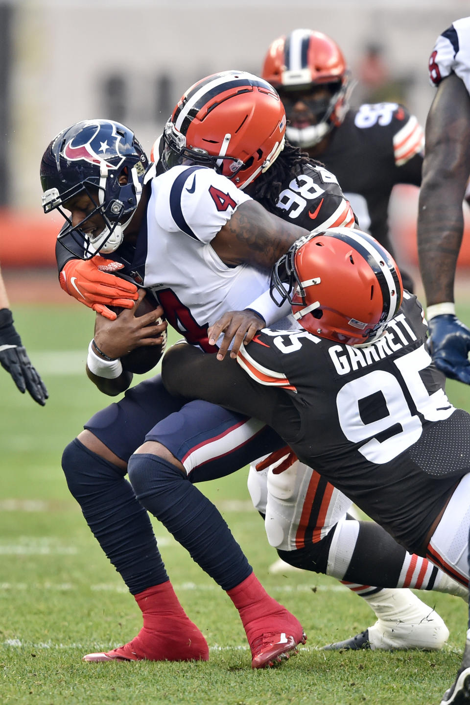 Cleveland Browns defensive end Myles Garrett (95) sacks Houston Texans quarterback Deshaun Watson (4) during the first half of an NFL football game, Sunday, Nov. 15, 2020, in Cleveland. (AP Photo/David Richard)