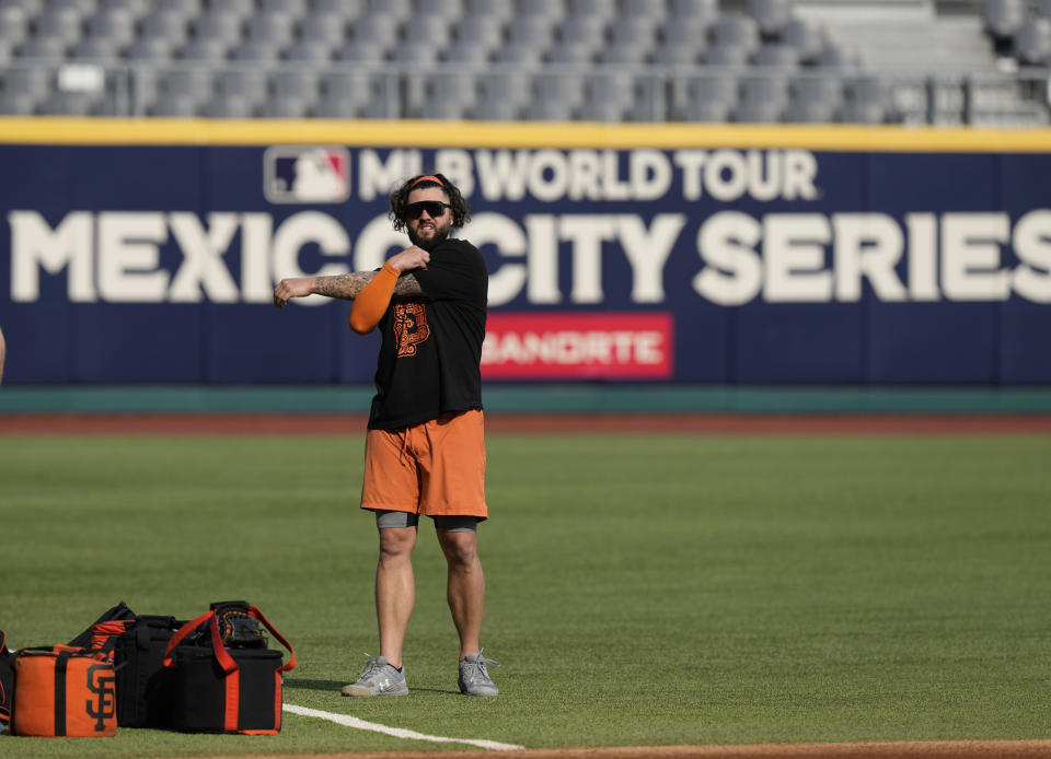 San Francisco Giants pitcher Jakob Junis stretches during a practice session at Alfredo Harp Helu Stadium in Mexico City, Friday, April 28, 2023. (AP Photo/Fernando Llano)