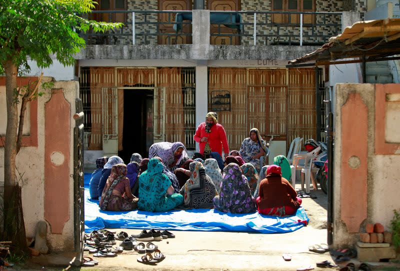 Relatives of Jagdish Baldevbhai Patel mourn in Dingucha village