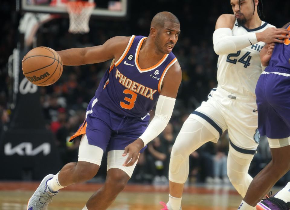 Phoenix Suns guard Chris Paul (3) drives past Memphis Grizzlies forward Dillon Brooks at Footprint Center on Jan. 22, 2023.