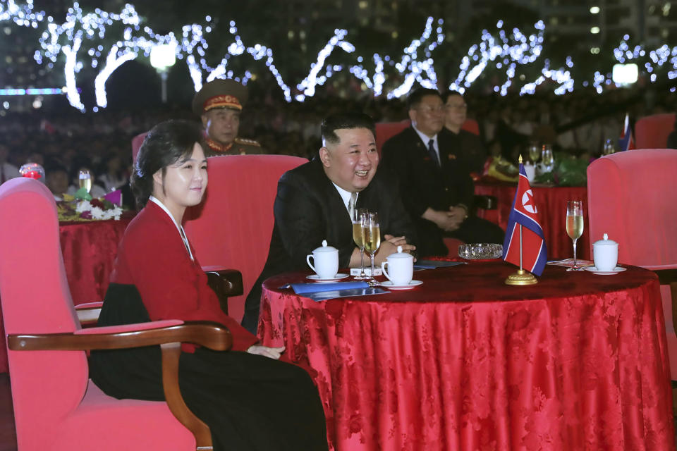 This photo provided by the North Korean government shows North Korean leader Kim Jong Un, center, and his wife Ri Sol Ju, left, watch a performance during a celebration marking the nation's 74th anniversary in Pyongyang, North Korea, on Sept. 8, 2022. Independent journalists were not given access to cover the event depicted in this image distributed by the North Korean government. The content of this image is as provided and cannot be independently verified. (Korean Central News Agency/Korea News Service via AP)
