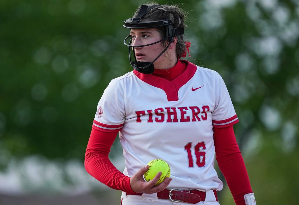 Fishers Tigers Kate Murray (16) holds the ball on the mound Tuesday, April 25, 2023 at Fishers High School in Fishers. The Fishers Tigers defeated the Hamilton Southeastern Royals, 1-0. 